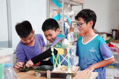 "Young Engineers" from Grade 3 design earthquake-resistant house models.